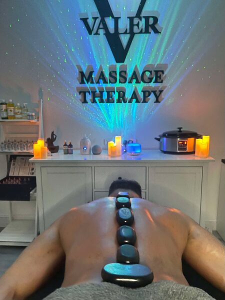 Hot stones on mans back